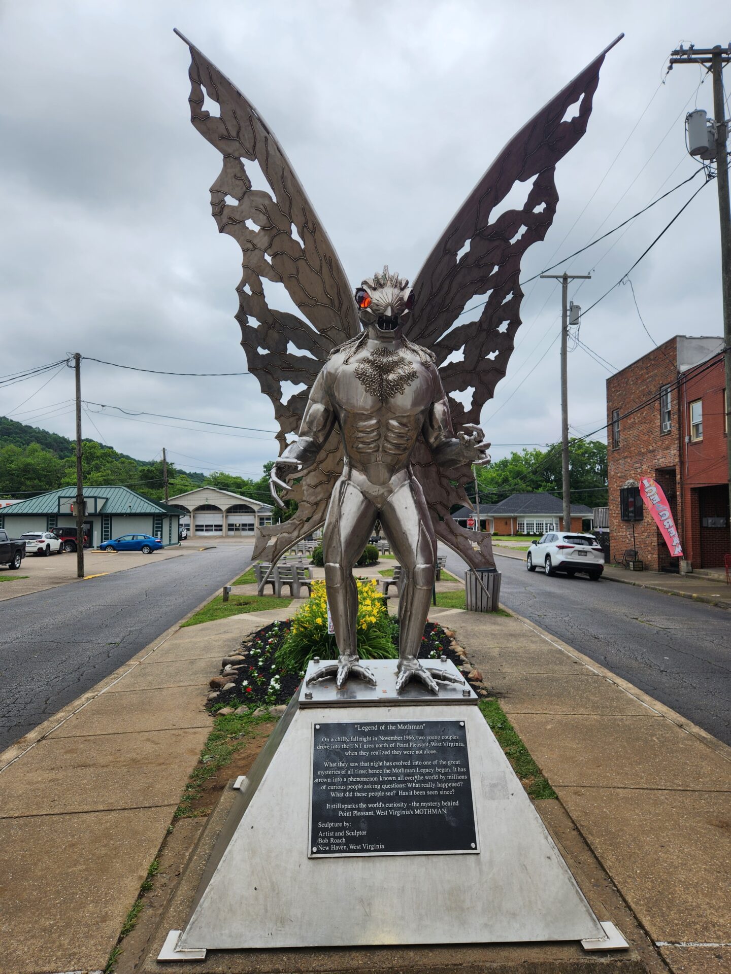 A statue and plaque commemorating Mothman in Point Pleasant, West Virginia, US